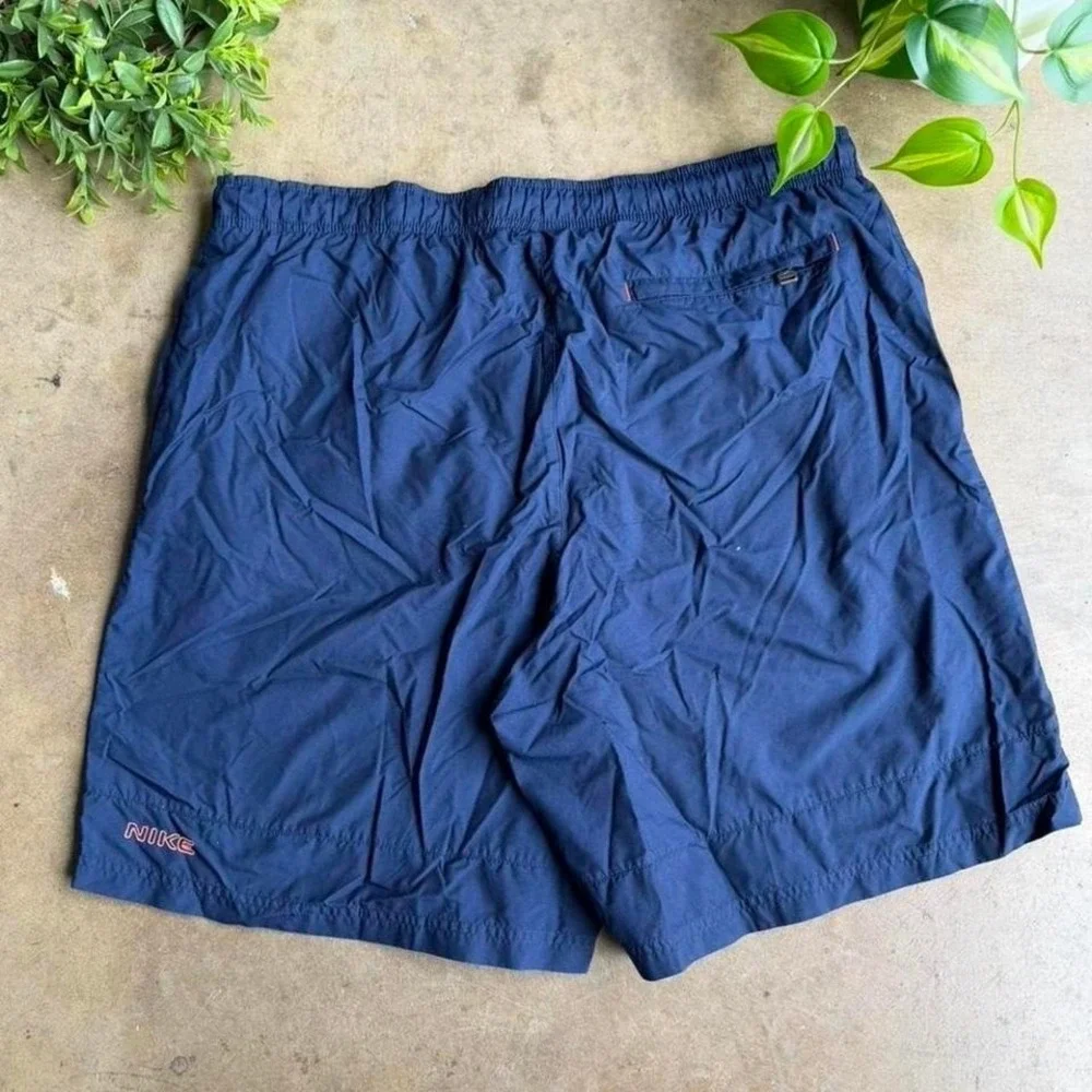 Vintage Y2K Nike spell out navy blue swim trunk shorts size L